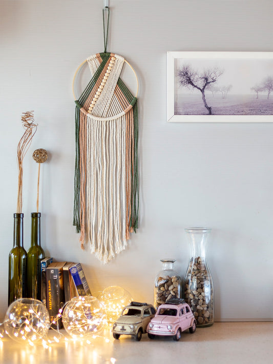 Add a touch of bohemian elegance to any space with our hand-woven tassel wall hanging. Made with premium materials, this unique piece blends earthy textures and playful tassels for a one-of-a-kind look. Perfect for adding texture and visual interest to your walls.