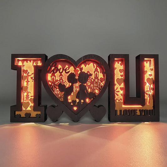 This I Love U Wooden Art Night Light is the perfect way to light up your bedroom this Valentine's Day. The attractive design showcases laser-cut letters spelling out “I Love U” in a wooden frame, and provides comfortable lighting from an LED light bulb. Ideal for a romantic atmosphere.