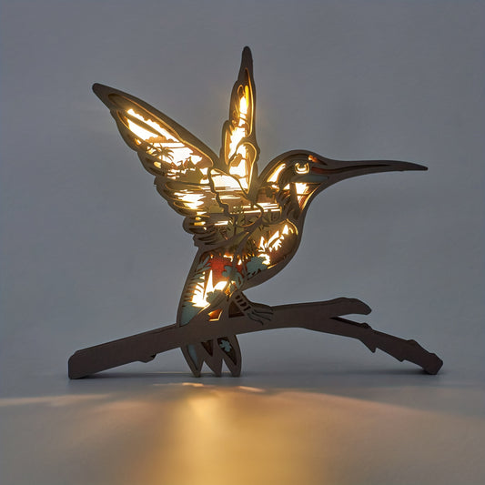 The Hummingbird Delight night light is an exquisite wooden art carving, perfect for adding a warm, inviting ambience to your bedroom décor. Crafted with premium materials for lasting use, the night light provides a unique, detailed design that adds a touch of beauty to any room.