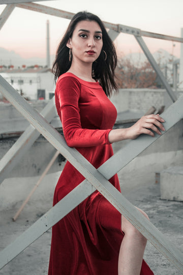woman standing near metal fence