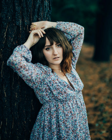 woman in blue and red floral long sleeve dress