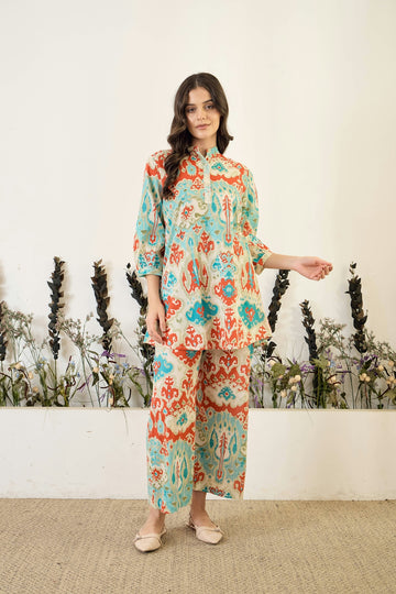 Woman in patterned tunic and pants