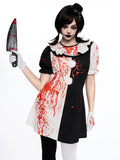 Front view of black white harlequin clown dress with red splatter and pom pom buttons