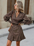 Side front view of brown boho printed mini dress with high waist and flared hem