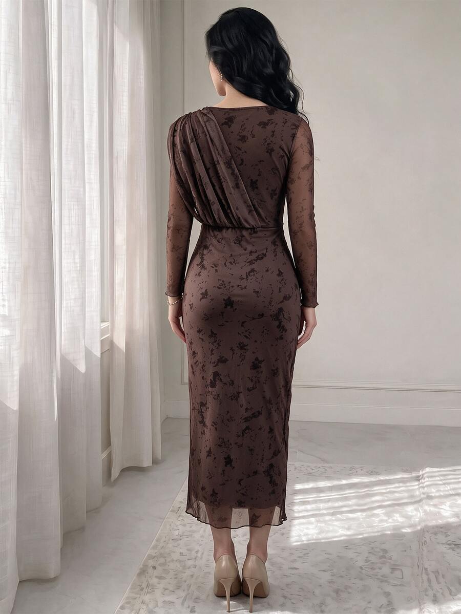 Front full view of brown floral midi dress with draped waist and gold-tone buckle beside staircase