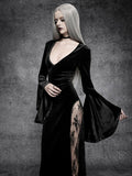 Close-up of black velvet deep V bodice, fitted waist, and dramatic cloak sleeve on gothic maxi dress