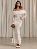 Front angle showing translucent floral sleeves and textured ivory dress overlay