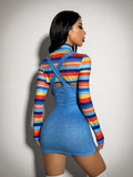 Rainbow striped crop top and blue pinafore dress for a retro Halloween costume