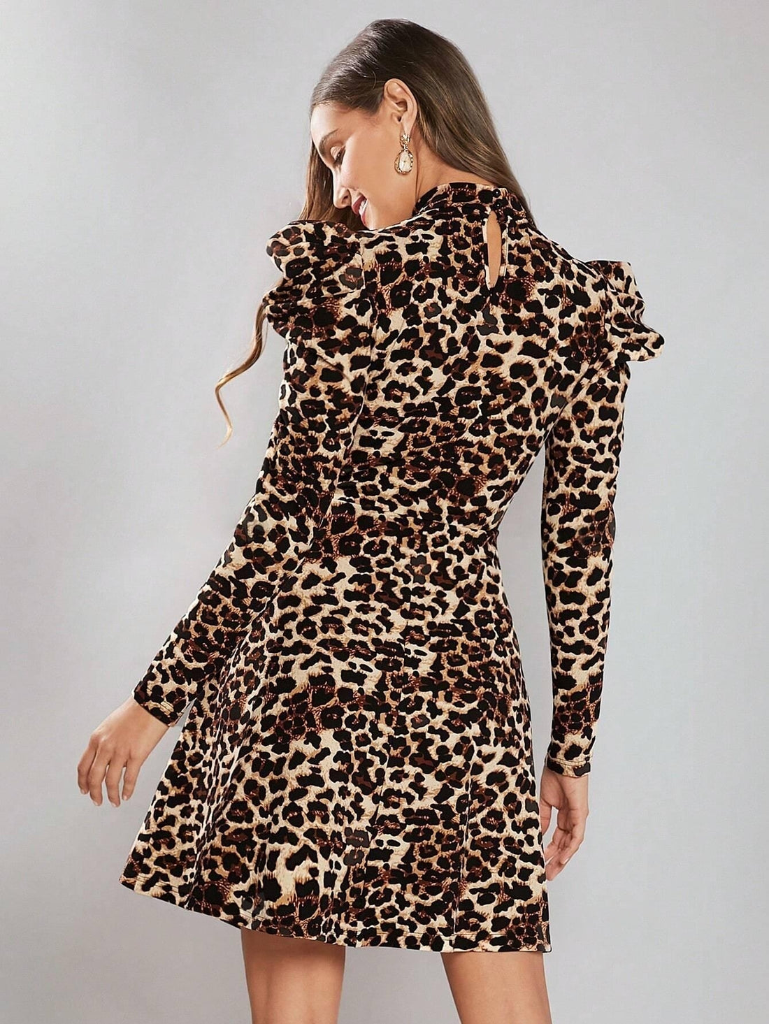 Add a statement of elegance to your wardrobe with our Chic Leopard Print Mock Neck Gigot Sleeve Dress. The stylish mock neck and gigot sleeves create a chic and sophisticated look perfect for any occasion. The bold leopard print adds a touch of playfulness to this classy dress.