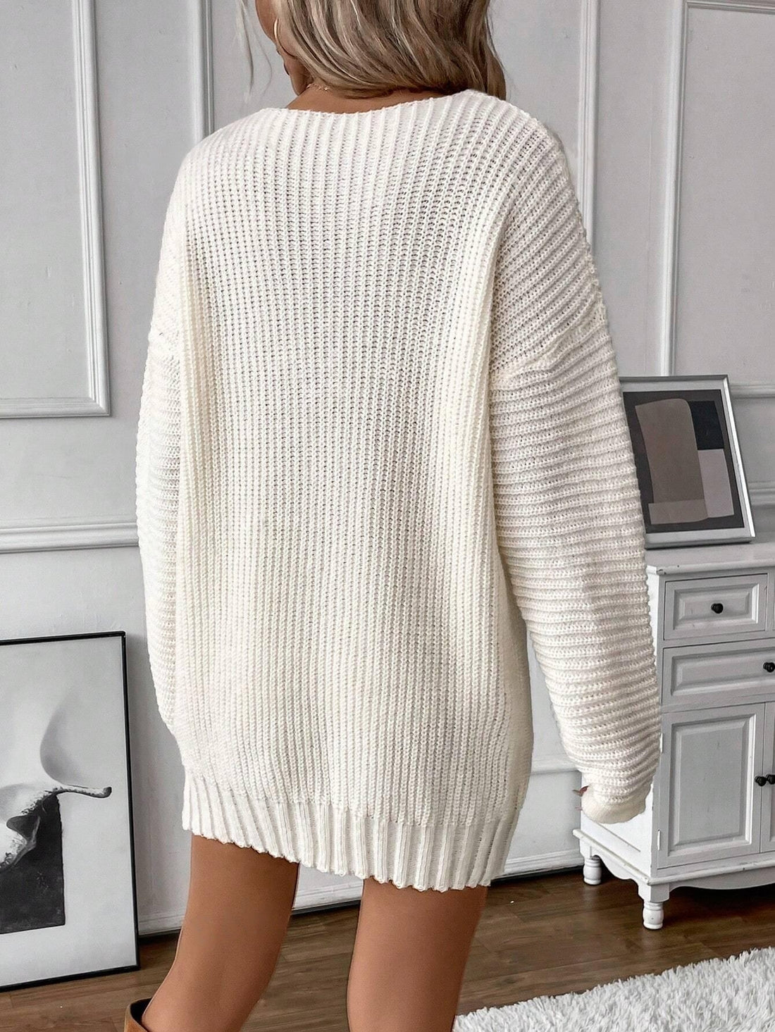 Elevate your casual wardrobe with our Luxe-Look Oversized Knit V-Neck Dress. The perfect combination of comfort and style, this must-have dress features a soft, oversized knit and a flattering v-neckline. Experience the ultimate in casual chic style with this versatile piece.