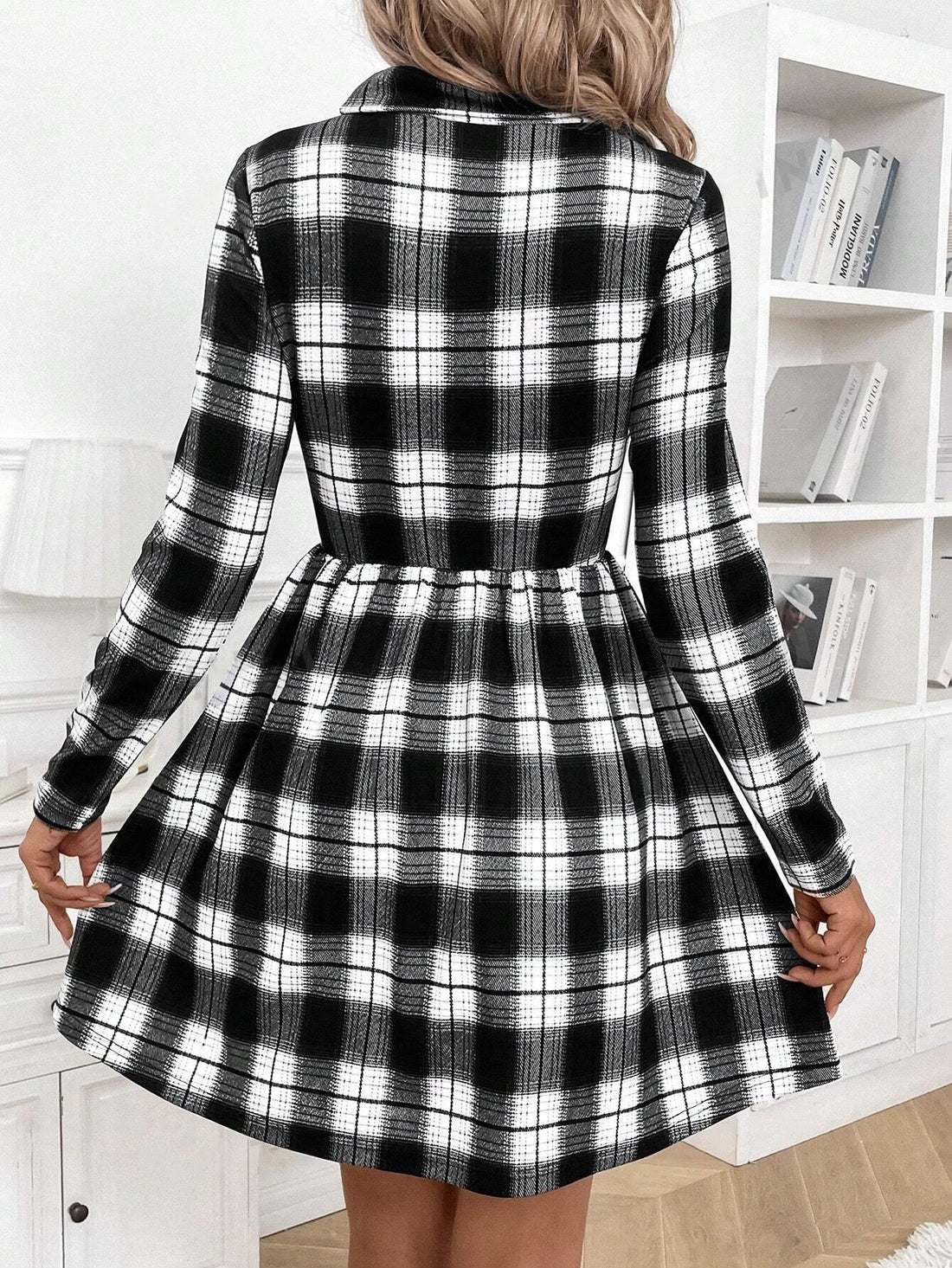 This Black and White Plaid Bodycon Dress is a timeless staple for both daily and professional wear. Made with a classic plaid pattern, this dress offers a versatile and chic look. Its bodycon fit flatters your figure while providing comfort and confidence. Perfect for any occasion, this dress is a must-have in your wardrobe.