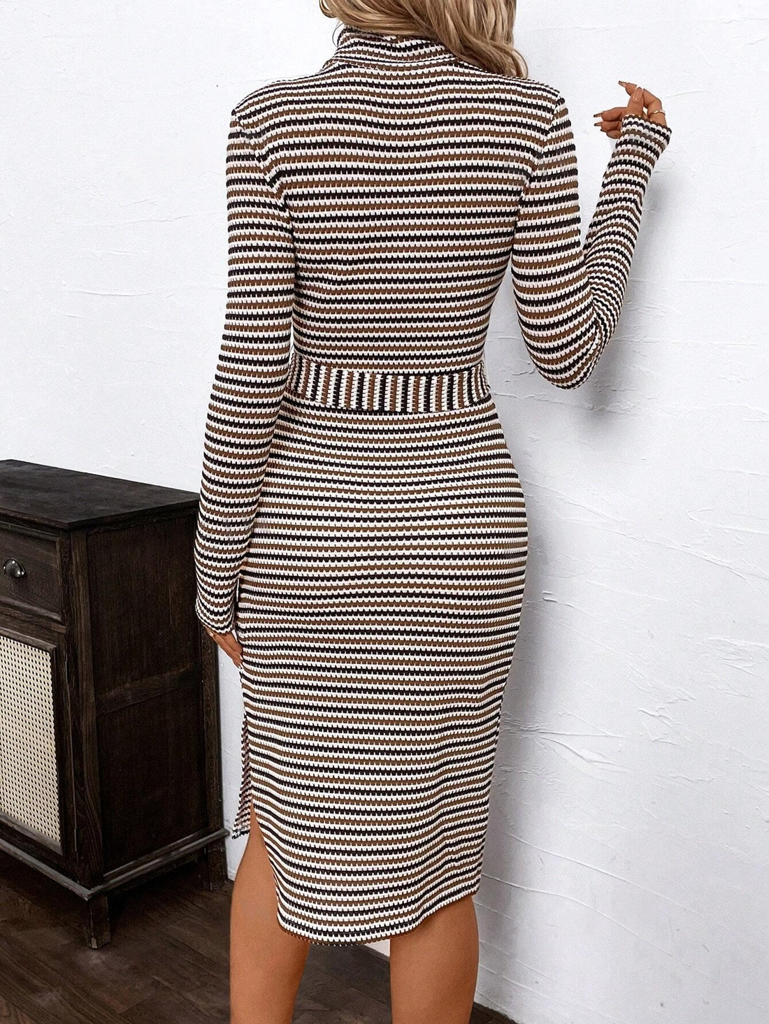 This turtleneck midi dress is perfect for work and winter. With its geometric design, it brings a touch of elegance to any outfit. Made with high-quality materials, it will keep you warm and stylish during the colder months. Don't sacrifice fashion for function with this versatile piece.