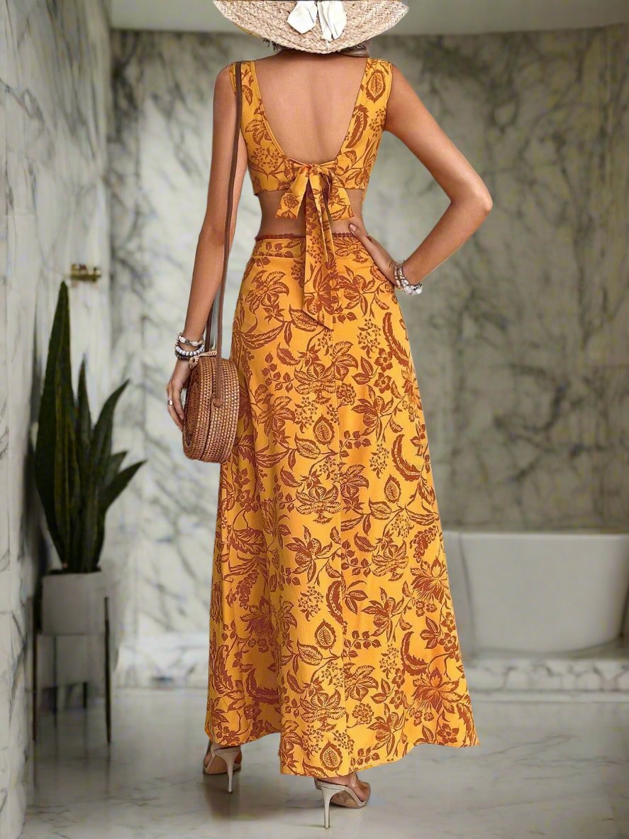 Get ready for your next vacation with our Vacation Ready: Plants Print Cut-Out Waist Dress! This stylish dress features a fun and vibrant plant print that will make you stand out. The cut-out waist adds a touch of elegance and the lightweight fabric is perfect for warm weather destinations. Get ready to turn heads and feel confident in this must-have dress.