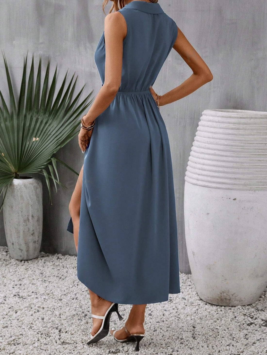 Effortlessly elevate your style with our Elegant and Effortless: Ladies Solid Color Sleeveless Split Dress. Featuring a chic split design and sophisticated solid color, this dress will make a statement at any event. Its sleeveless design adds a touch of elegance, making it the perfect choice for any occasion.
