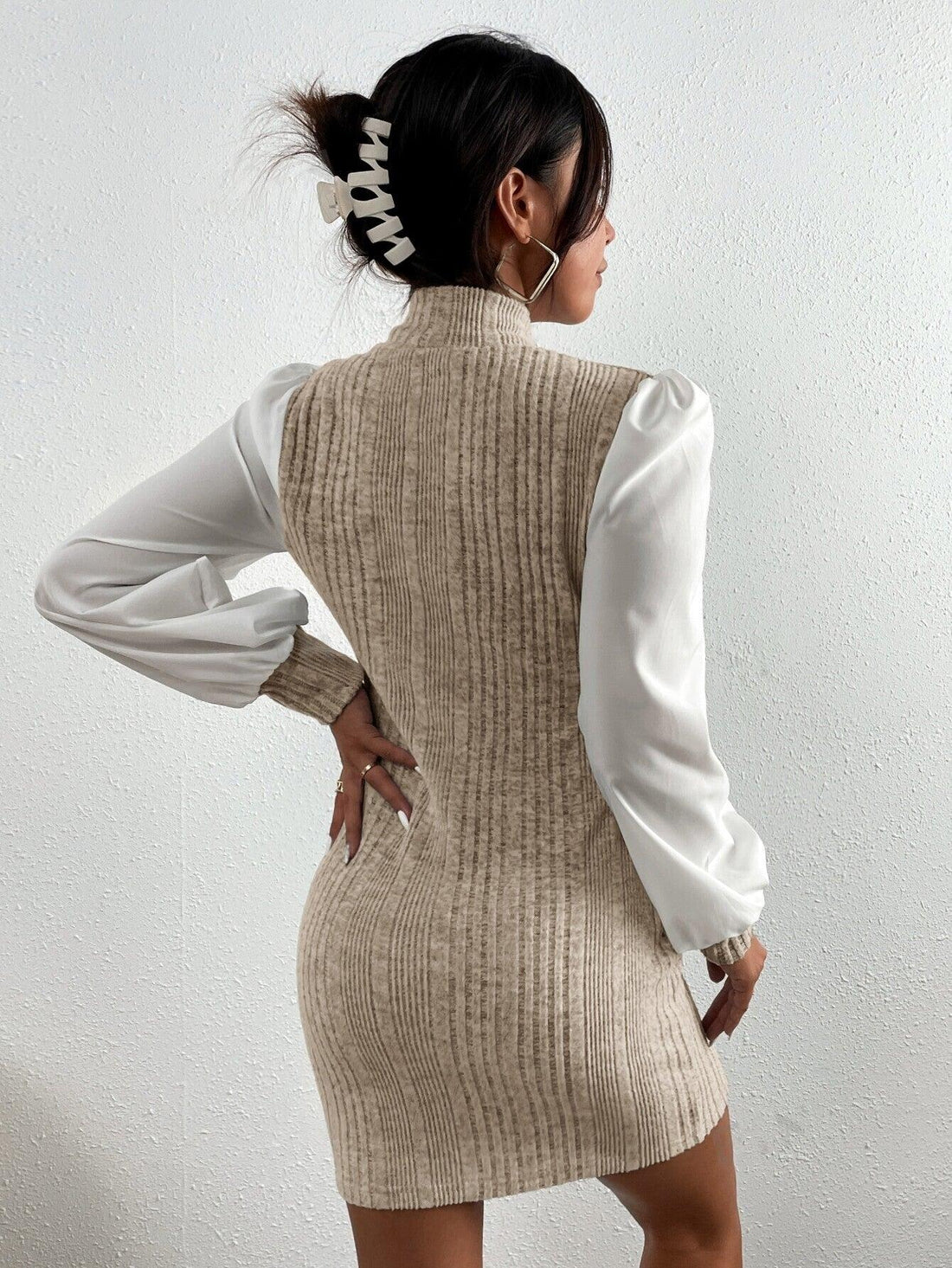 This Ribbed Stand Collar Dress with Bishop Sleeves is the epitome of sophistication. The ribbed design adds texture, while the stand collar and bishop sleeves create a unique and elegant silhouette. Perfect for any occasion, this dress is a must-have for the fashion-forward woman.