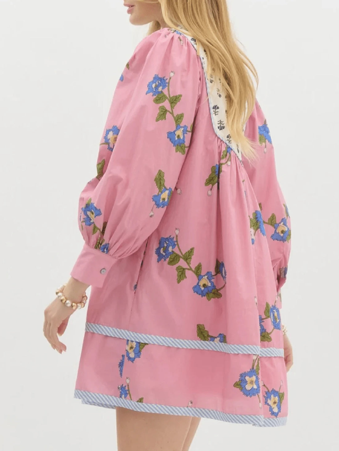 Embrace effortless bohemian style with this charming floral mini dress. Featuring a flattering V-neckline, romantic puff sleeves, and an A-line silhouette, this versatile piece transitions seamlessly from garden gatherings to casual street wear. The loose fit and medium stretch fabric ensure all-day comfort, while the delicate floral print adds a touch of whimsy. Perfect for spring and summer adventures, this dress pairs beautifully with sandals or sneakers for an understated, chic look that celebrates your