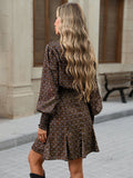 Back view of brown printed long sleeve A-line mini dress with flounce hem