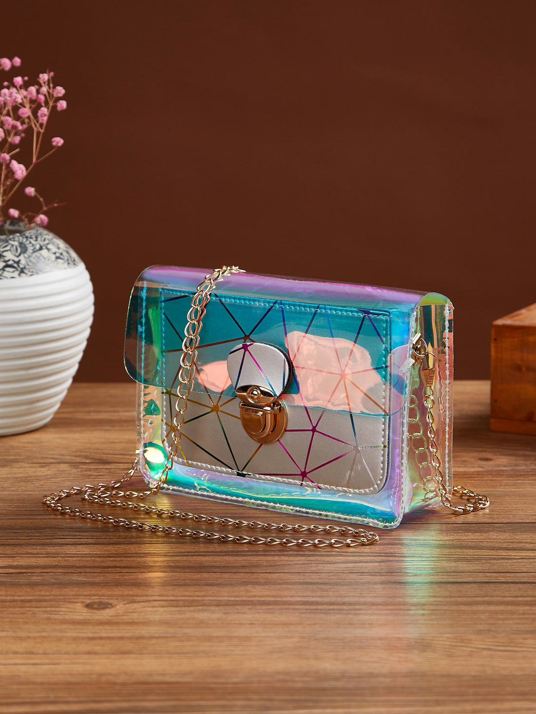 Stay stylish and organized with our Chic and Practical Chain Bag. Its waterproof and lightweight design is perfect for girls, women, and professionals on the go. The holographic geometric pattern adds a trendy touch to any outfit. Stay worry-free and fashionable with this must-have bag.