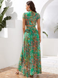 Front view of turquoise tropical twist-front crop top with maxi wrap skirt
