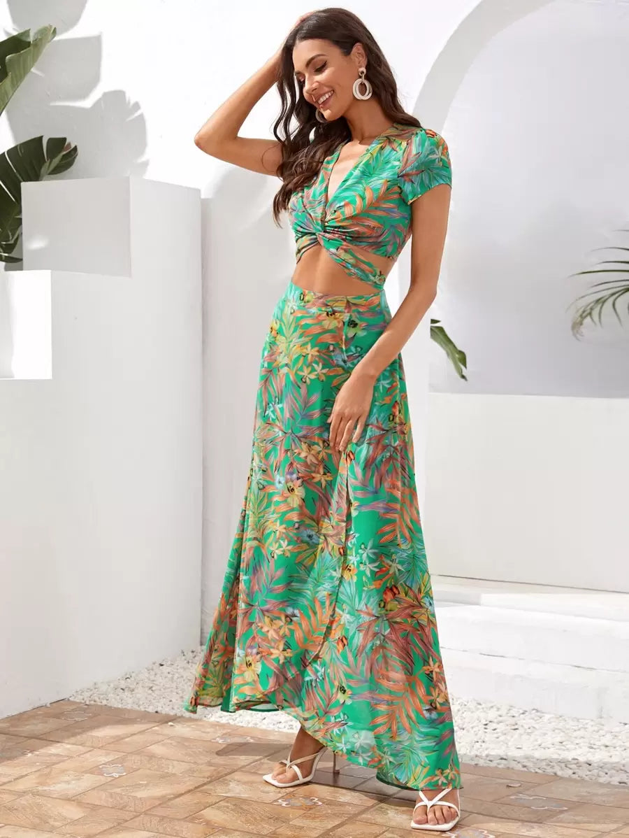 Back view of tropical crop top with adjustable tie and flowing wrap skirt
