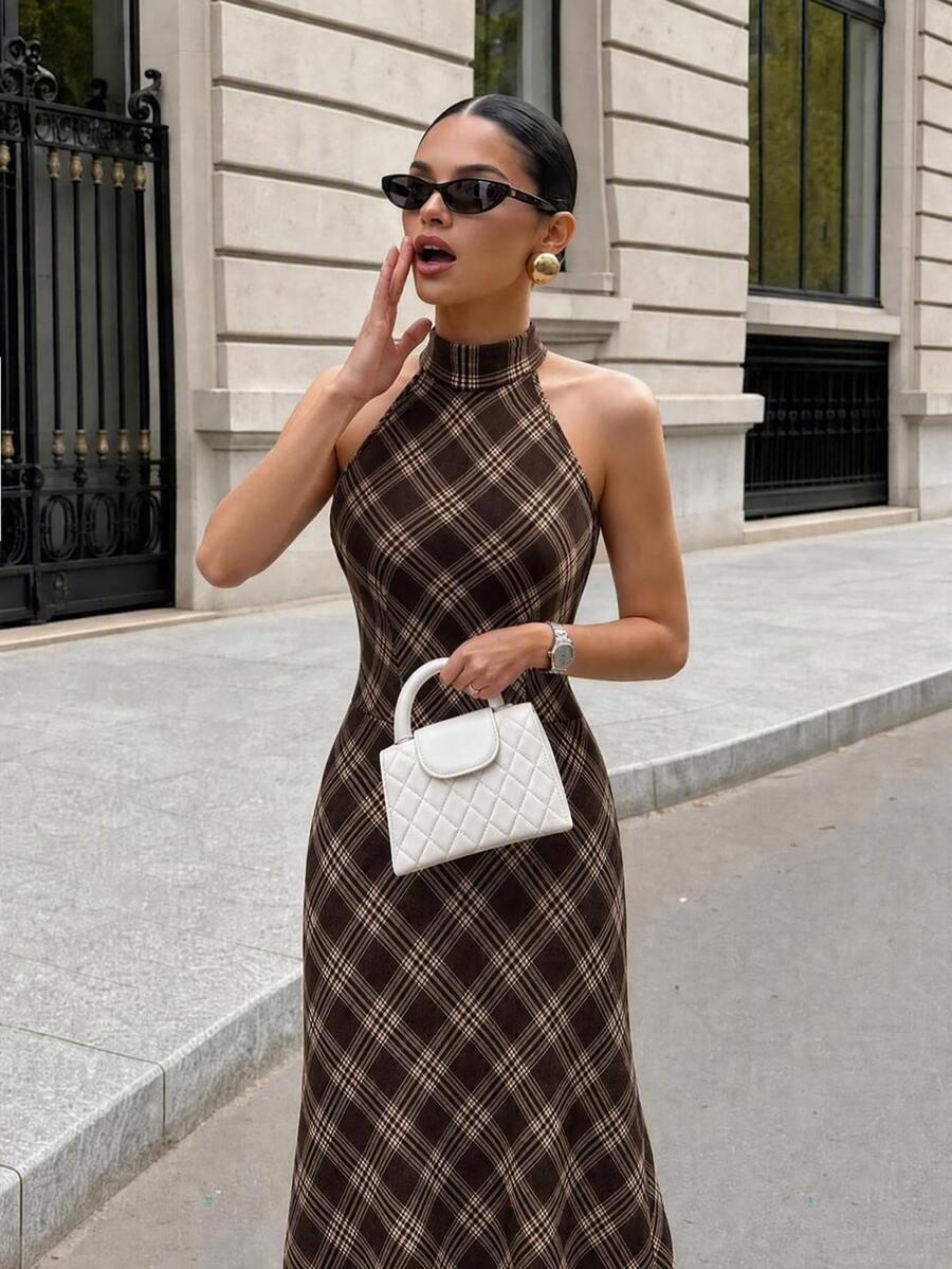 Cropped front view showing the brown plaid halter neckline, fitted bodice and diagonal cream check pattern.