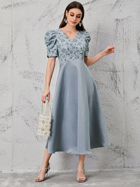 Elevate your wardrobe with our Floral Fantasy: Puff Sleeve Jacquard Bodice Dress. The elegant jacquard fabric and delicate floral pattern bring a touch of whimsy, while the puff sleeves add a romantic flair. Perfect for any special occasion, this dress is sure to make you stand out in style.