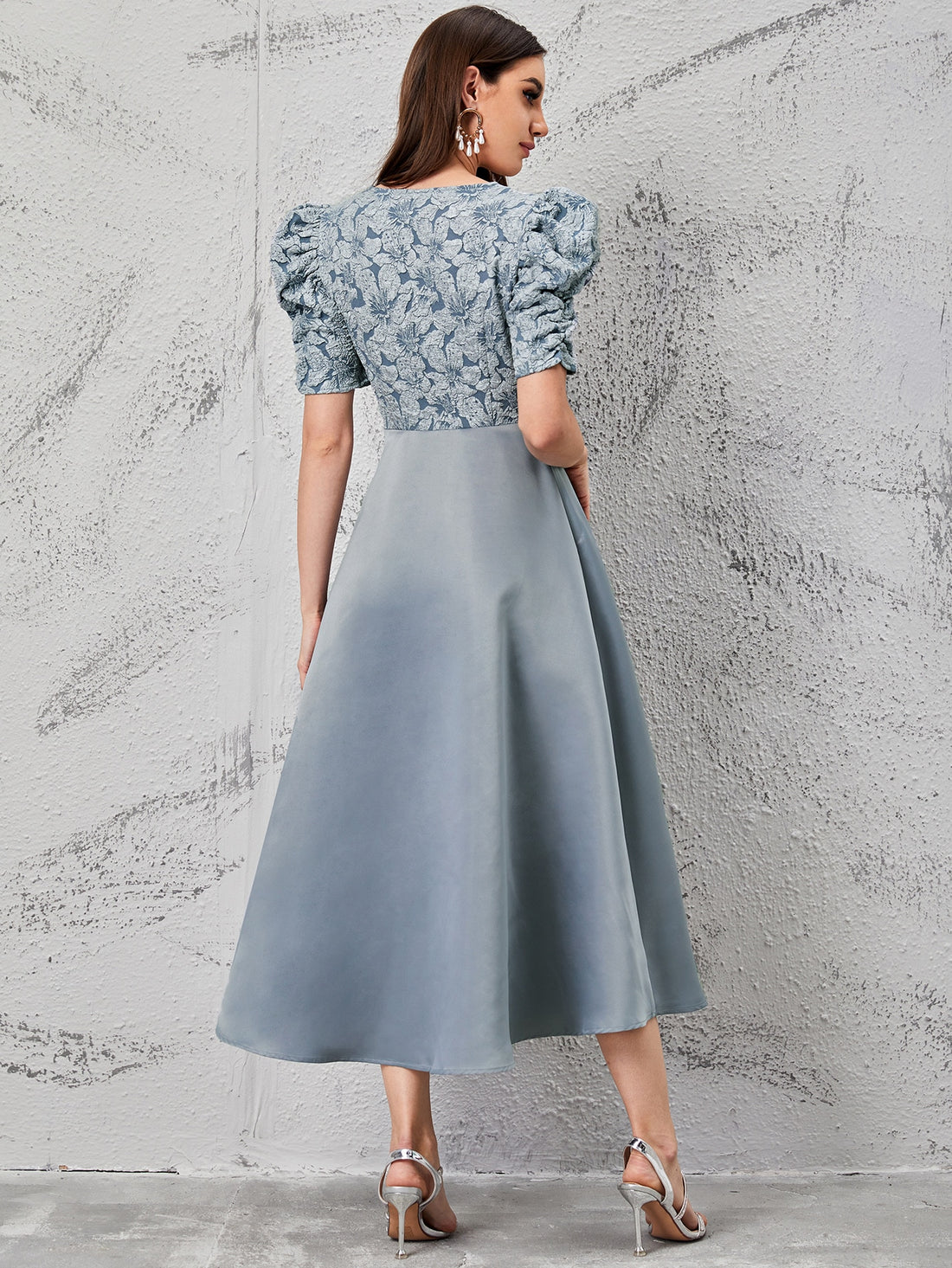 Elevate your wardrobe with our Floral Fantasy: Puff Sleeve Jacquard Bodice Dress. The elegant jacquard fabric and delicate floral pattern bring a touch of whimsy, while the puff sleeves add a romantic flair. Perfect for any special occasion, this dress is sure to make you stand out in style.