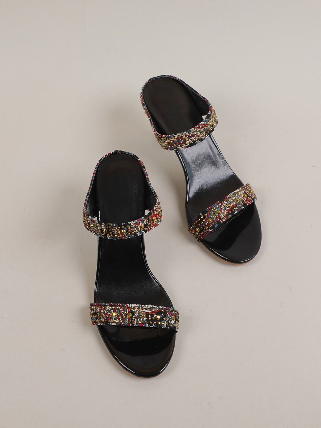 Elevate your style with our Chic Studded Color Block Stiletto Heeled Mule Sandals. These statement shoes feature a unique color block design and stud detailing, adding a touch of edginess to any outfit. With a sturdy stiletto heel, they provide both fashion and comfort for any occasion.