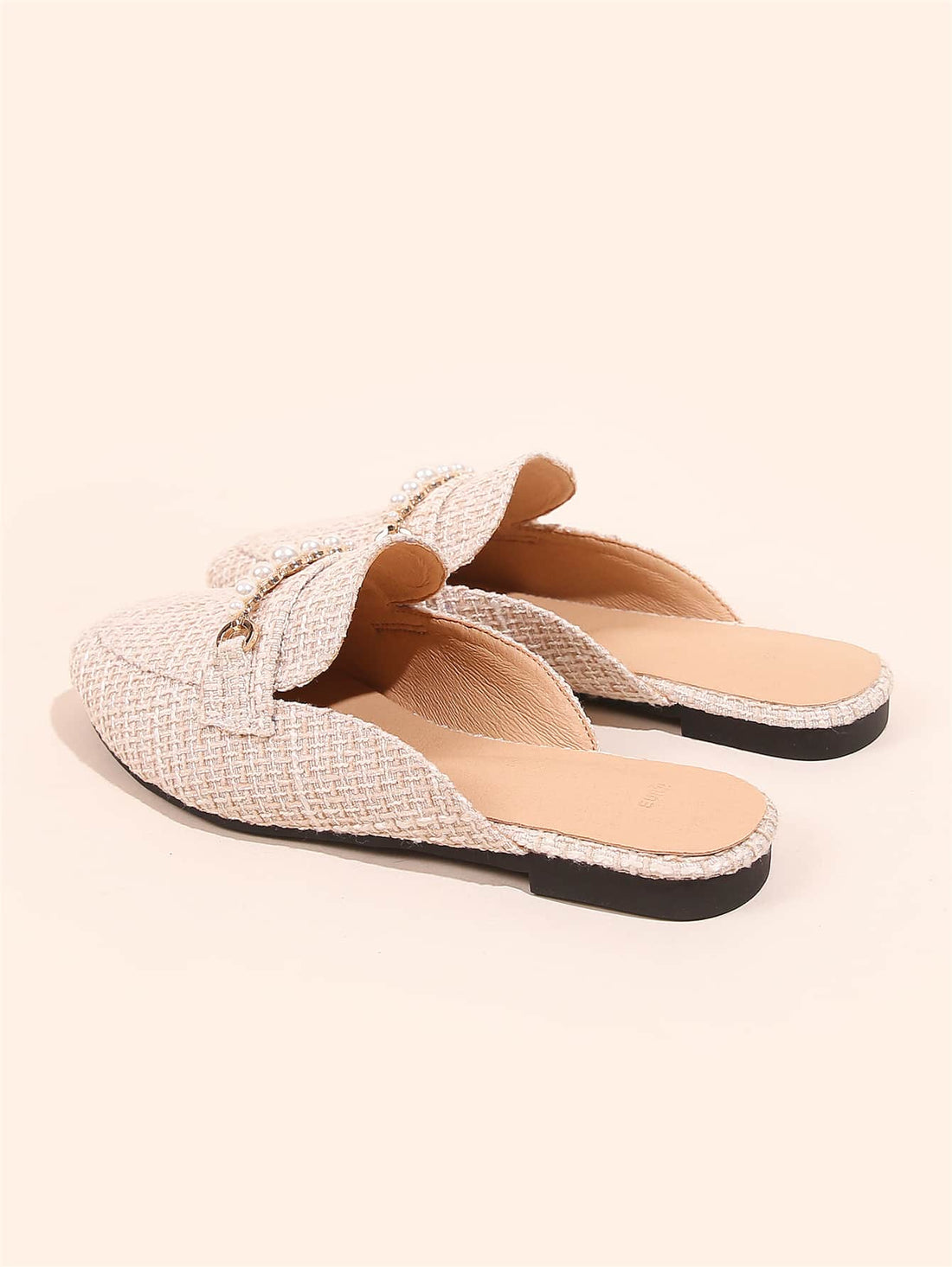 Slip into effortless elegance with these charming loafer mules, adorned with lustrous faux pearl details that catch the light beautifully. Designed for the cooler months, they transition seamlessly from casual outings to special occasions—think cozy coffee dates or romantic dinners. The relaxed mule silhouette offers all-day comfort without sacrificing style, while the pearl embellishments add that perfect touch of sophistication. Whether you're treating yourself or surprising someone special, these versati