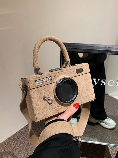 With our Mini Camera Design Box Bag, you can stylishly capture every moment in high quality. The compact design allows for easy portability, while the camera-inspired design adds a unique touch. Don't miss a single moment with this must-have accessory.