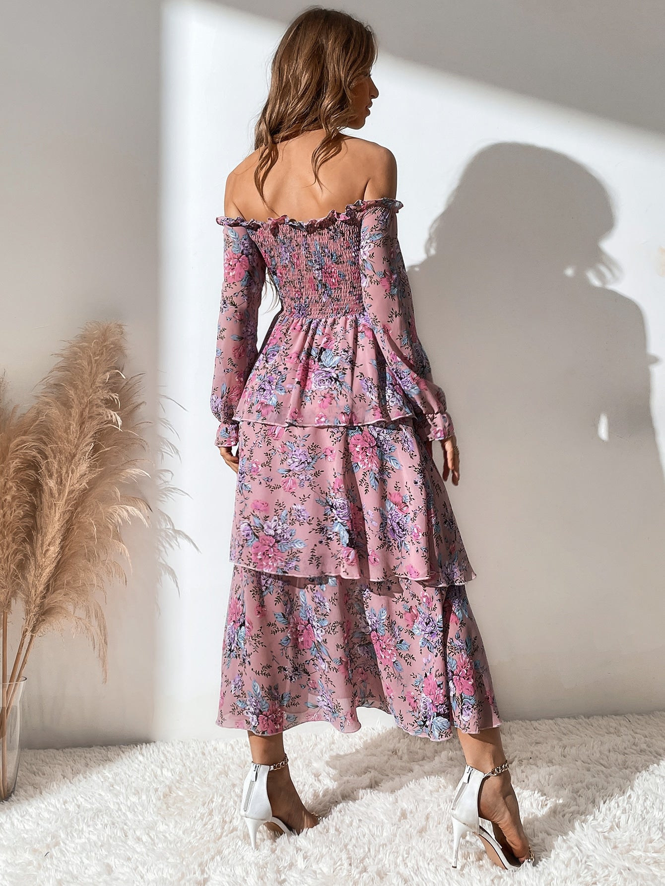 Unleash your bohemian spirit with our Floral Off-The-Shoulder Shirred Dress. With a playful layered hem, this dress adds a touch of whimsy to your wardrobe. The off-the-shoulder design is perfect for dancing the day away at festivals (just don't forget the flower crown)!