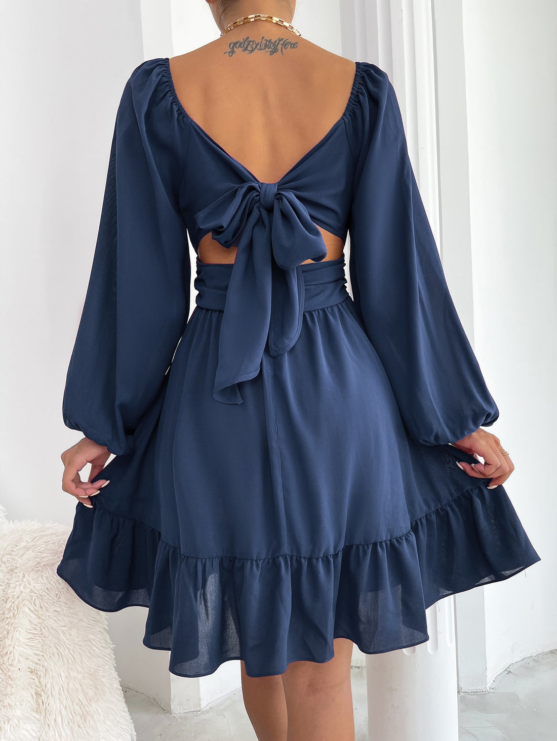 Effortlessly style yourself with our Elegant Knot Back Lantern Sleeve Ruffle Hem Milkmaid Dress. The unique knot back design and playful ruffle hem add a touch of elegance to this versatile dress. With lantern sleeves, you'll be both stylish and comfortable. Perfect for any occasion.