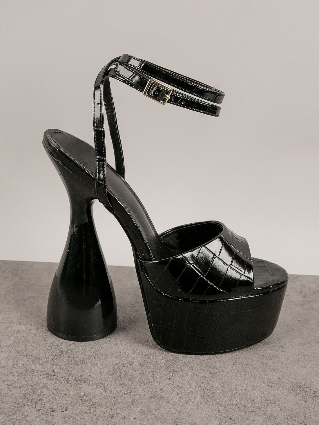 Add a touch of luxury to your wardrobe with Exotic Elegance: Crocodile Peep Toe Platform Statement High Heels. These stylish heels feature a unique crocodile pattern and a comfortable platform design, perfect for making a statement at any event. Elevate your style with 100% genuine leather and chic peep toe detailing.