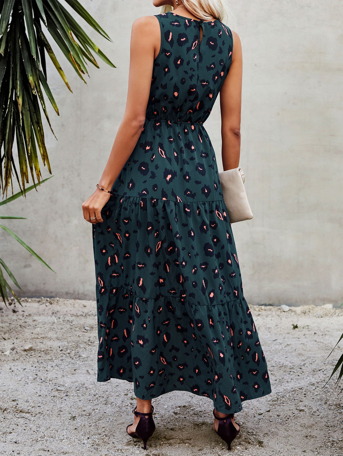 Add a touch of elegance to your wardrobe with our Vibrant Leopard Sleeveless Dress. The ruffle hem adds a playful touch to this timeless piece, perfect for any occasion. Embrace your wild side with the bold and vibrant leopard print.