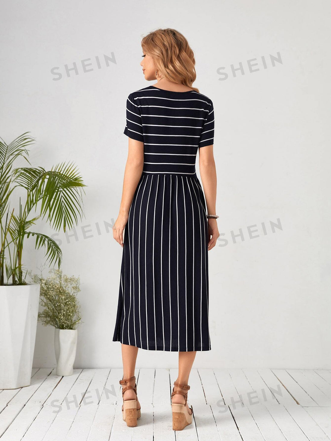 Elevate your wardrobe with this fabulous high-waisted striped dress that effortlessly transitions from brunch to evening plans. The classic stripe pattern adds timeless charm while the flattering high waist creates a gorgeous silhouette that works for virtually any body type. Whether you're dressing up for a special event or keeping it casual with sneakers, this versatile piece is your new go-to. Comfortable, chic, and endlessly stylish—because looking amazing should be this easy!