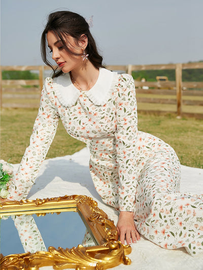 This charming Floral Fantasy dress features a delicate Ditsy Floral print and feminine Frill Trim details. The classic Peter Pan Collar adds a touch of elegance to this whimsical piece. Perfect for a romantic date or a casual day out, this dress will bring out your inner flower child.