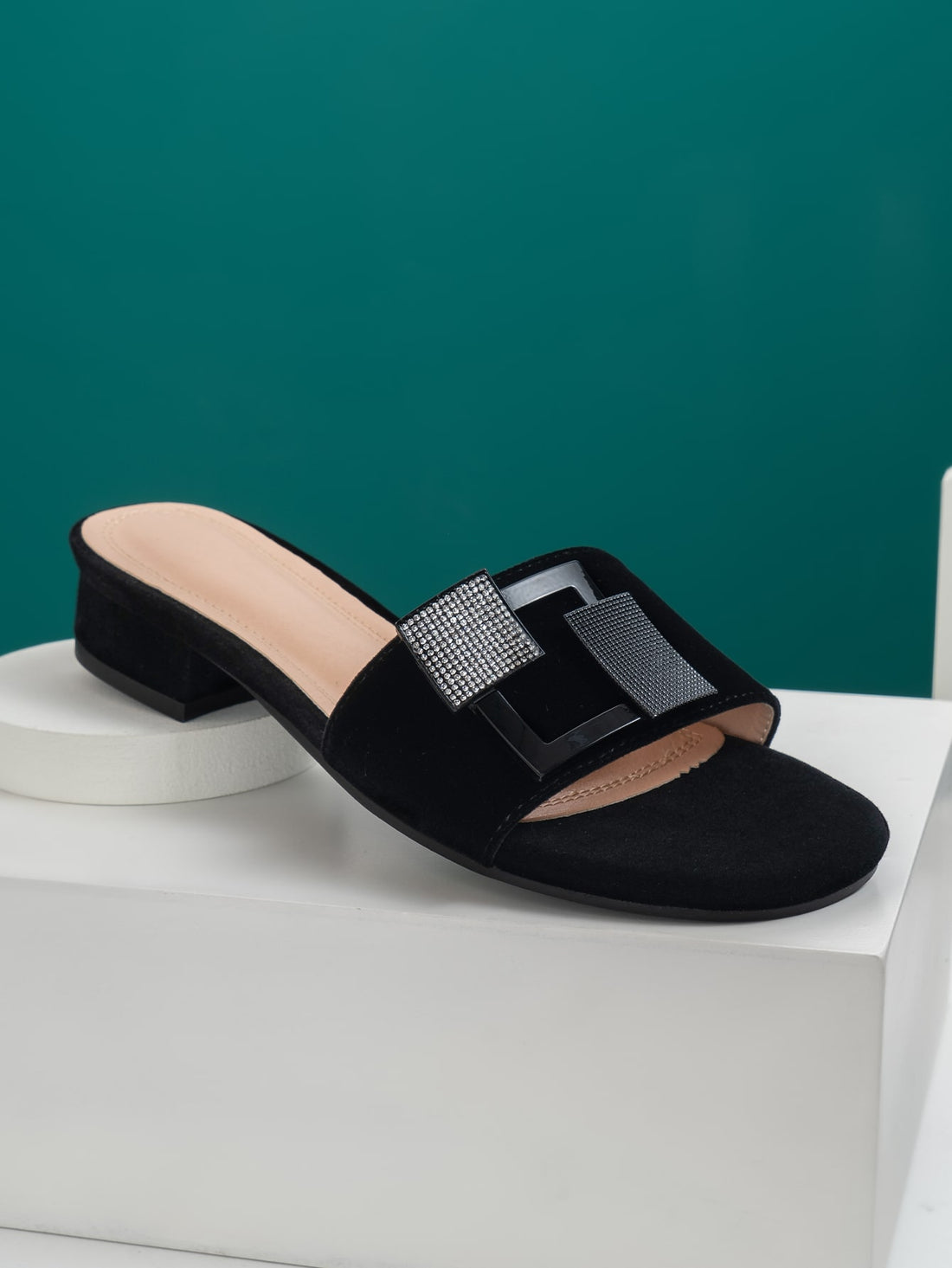 Sparkle through your summer with these dazzling rhinestone slide sandals! Designed for the woman who refuses to compromise on glamour, these trendy flats feature eye-catching embellishments that transform any casual outfit into a statement look. Slip them on for effortless style—whether you're heading to brunch, running errands, or soaking up the sun. Comfortable enough for all-day wear, these chic slides bring that perfect touch of bling to your warm-weather wardrobe. Because who says practical can't be fa