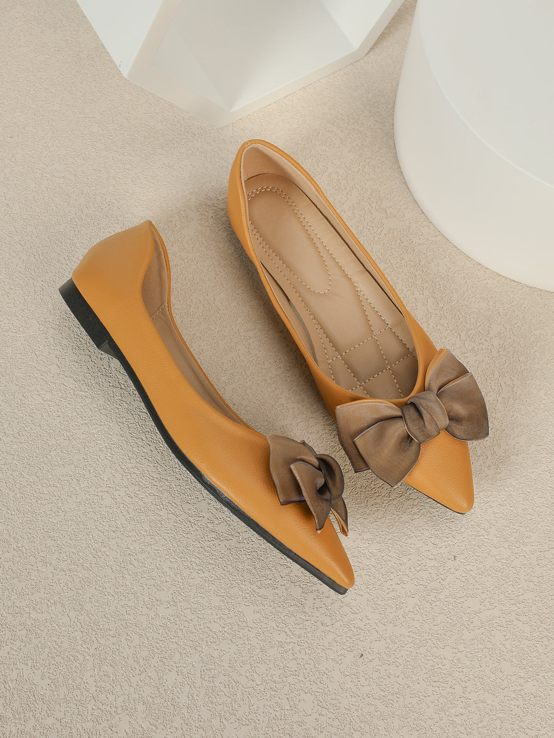 Effortlessly chic and stylish, these pointed toe ballet flats are the perfect addition to your Valentine's Day ensemble. With a playful bow decor, these flats elevate any outfit with a touch of romance. Walk with style and comfort this Valentine's Day!