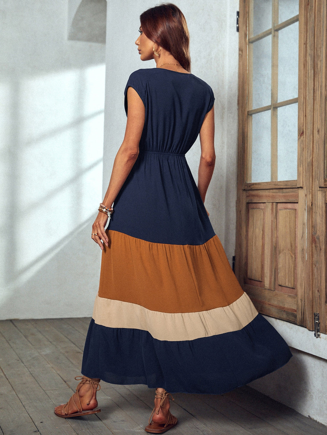 Make a statement with this Stylish Colorblock Maxi Dress! With its surplice neckline and flattering silhouette, it's perfect for any vacation or beach outing. Stand out in a bold colorblock design that's sure to turn heads. Comfortable and trendy, this dress is a must-have for any fashion-forward woman.