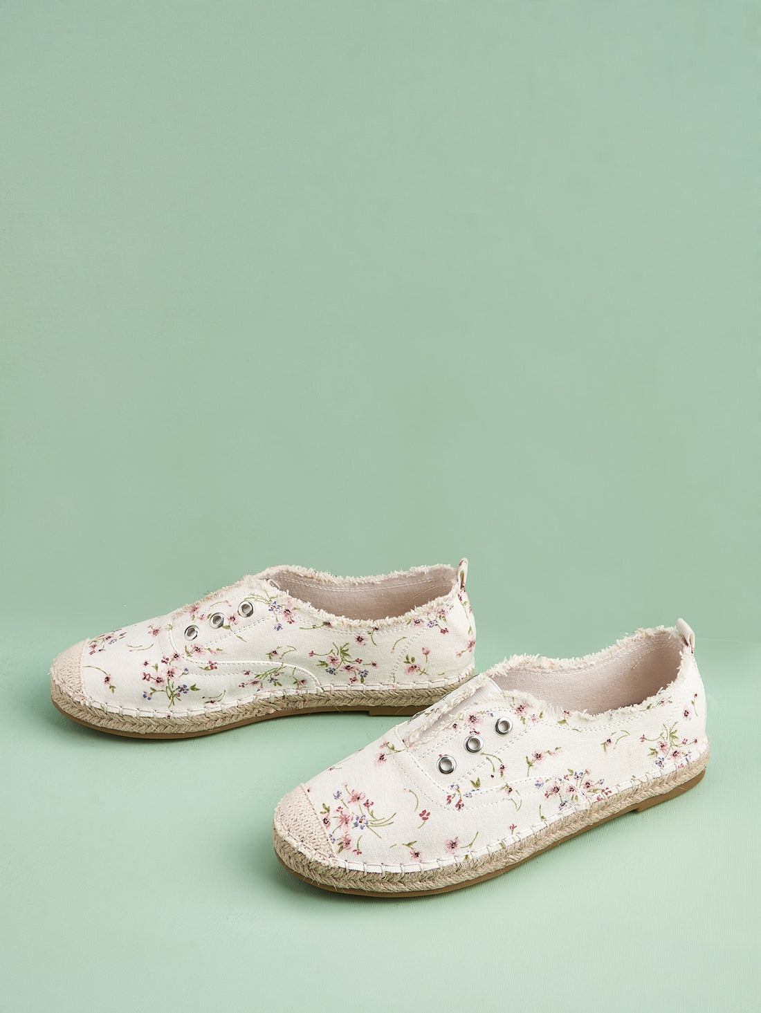 Add a touch of charm to your vacation style with our Chic Ditsy Floral Espadrille Flats. The eyelet detail adds a unique twist to these comfortable and stylish shoes. Perfect for any summer getaway, these flats are a must-have for any fashion-forward traveler.