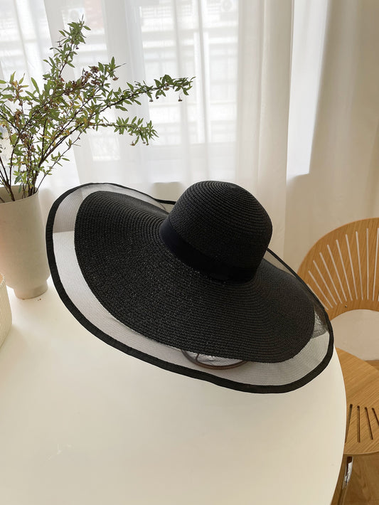 Introducing our Boho Chic Mesh Panel Straw Hat, perfect for sunny days. This stylish hat features a mesh panel design that allows for ventilation and a cool breeze while protecting you from harsh UV rays. Stay chic and cool this summer with our must-have hat.