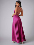Front pose of red violet gown showing draped bodice and flowing skirt