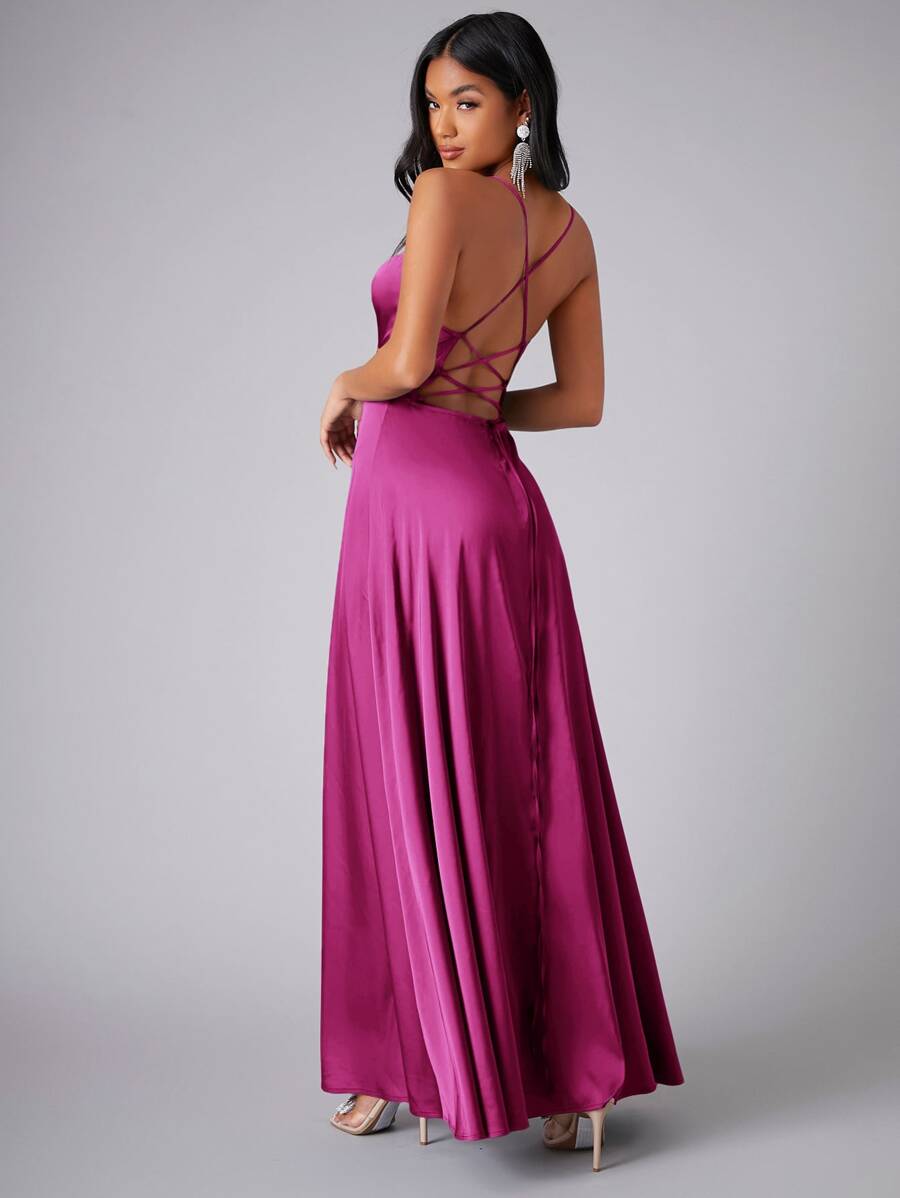 Front pose of red violet gown showing draped bodice and flowing skirt