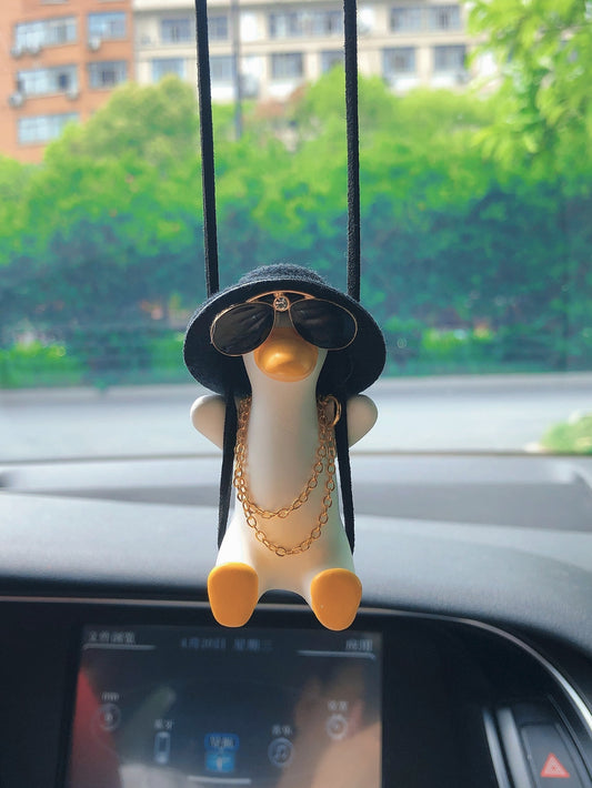 Introducing our Quirky &amp; Cute Cartoon Duck Car Hanging Ornament, the perfect addition to your car to add some fun to your drive! Made from high-quality materials, this adorable duck ornament will surely bring a smile to your face while you're on the road.