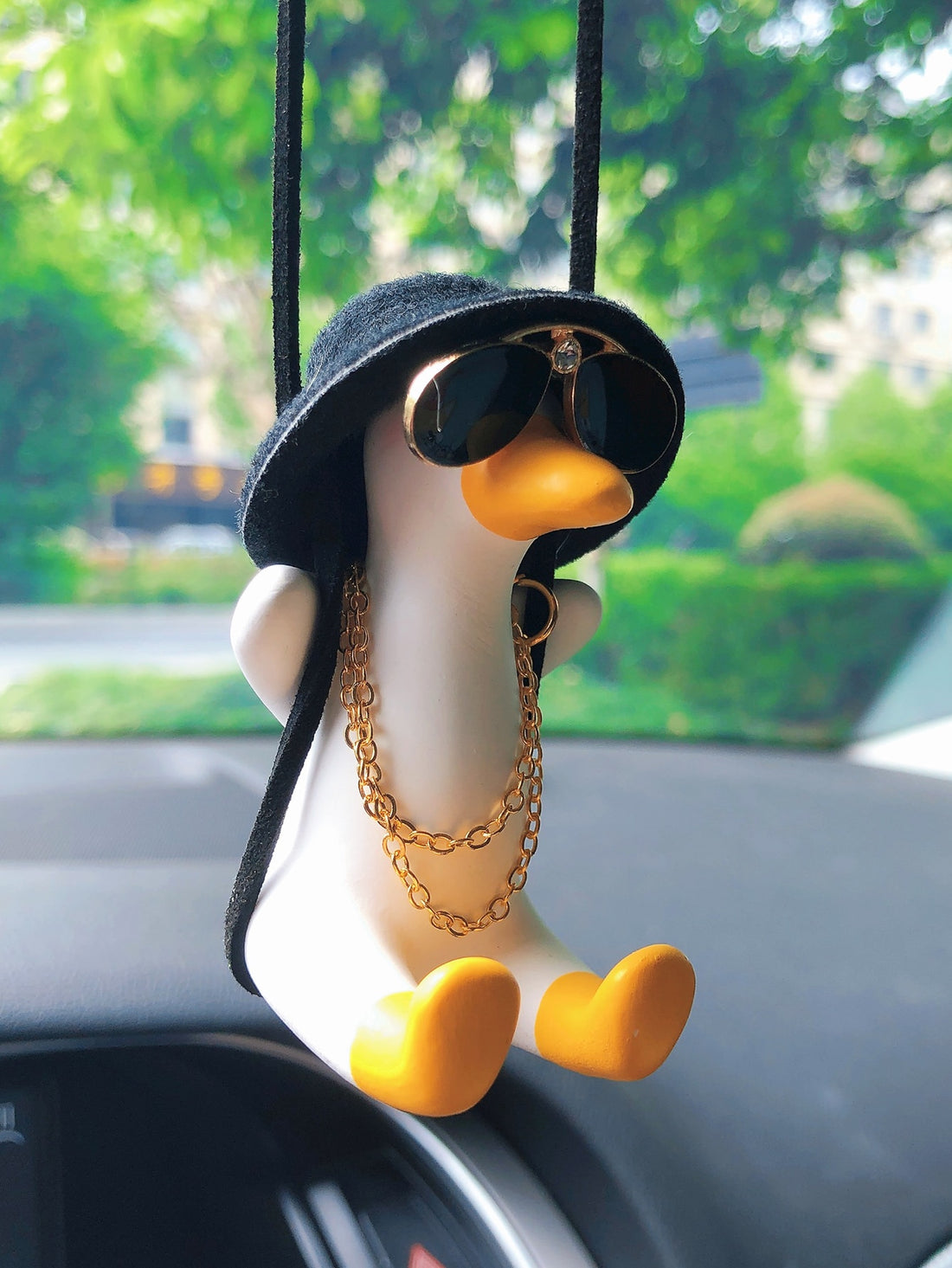 Introducing our Quirky &amp; Cute Cartoon Duck Car Hanging Ornament, the perfect addition to your car to add some fun to your drive! Made from high-quality materials, this adorable duck ornament will surely bring a smile to your face while you're on the road.