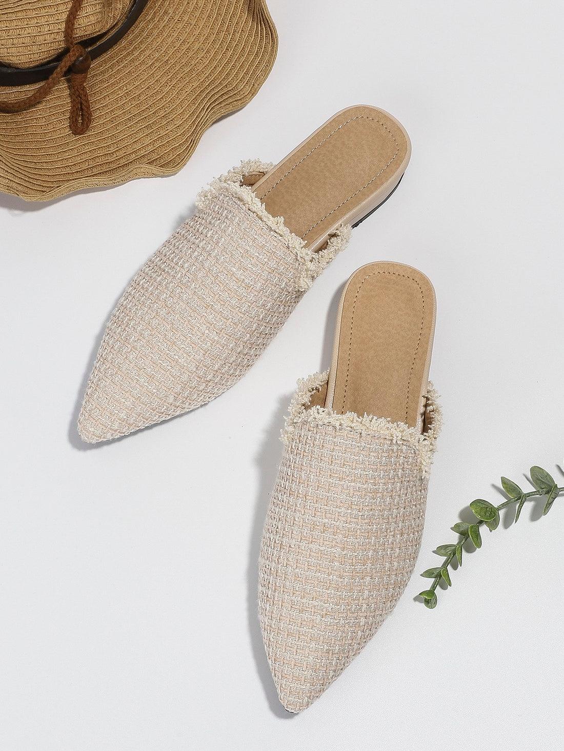 Discover effortless style with our chic raw trim pointed toe flat mules. The pointed toe design adds a touch of sophistication while the raw trim detailing completes the look with an effortlessly chic vibe. These mules are the perfect addition to any outfit, providing both comfort and style.