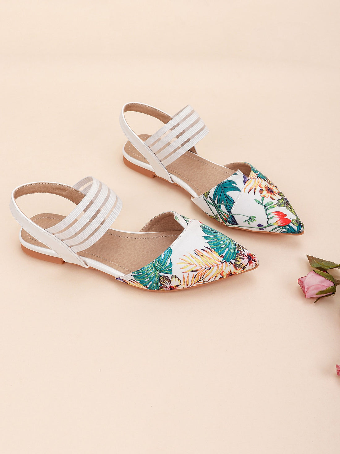 Effortlessly elevate your style with our Chic Tropical Print Pointed-Toe Ankle Strap Flats. The vibrant tropical print adds a touch of fun to any outfit, while the pointed-toe design adds a sleek and sophisticated touch. The ankle strap ensures a secure and comfortable fit.