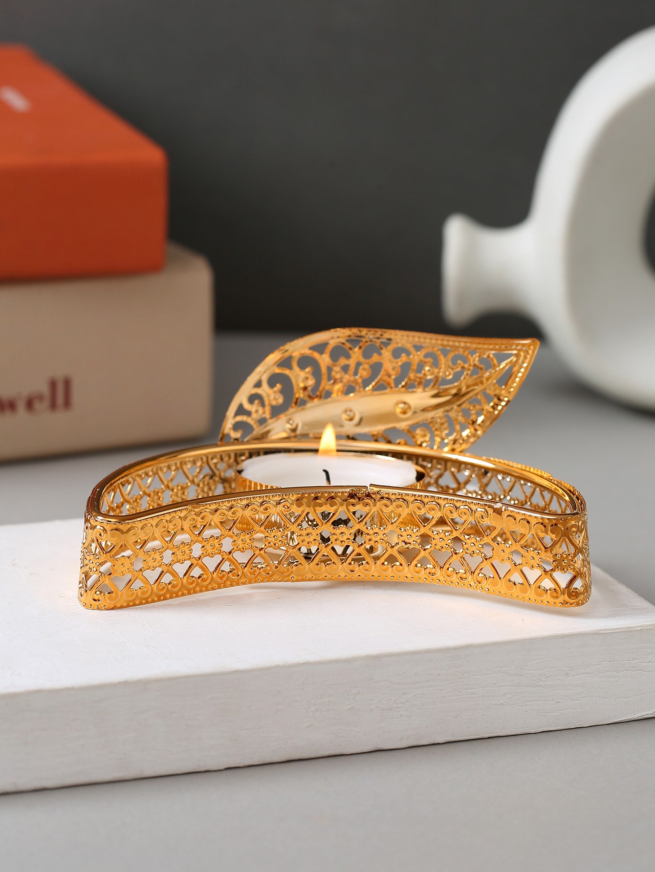 Add a touch of elegance to your space with the Leafy Glow Candle Holder. The leafy design allows the candle's glow to shine through, creating a warm and inviting atmosphere. Crafted with style and functionality in mind, this candle holder is the perfect addition to any room.