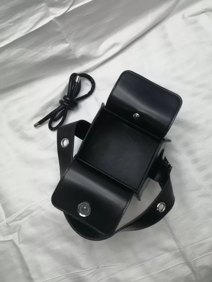 Carry your essentials in style with this adorable mini crossbody box bag! Perfect for days when you want to travel light without sacrificing sophistication. The structured boxy silhouette gives off major chic vibes, while the convenient mini handle and adjustable crossbody strap make it your new go-to for errands, outings, or casual adventures. Compact yet spacious enough for your phone, wallet, and keys—because looking fabulous shouldn't require a heavy load. Whether you're dashing to brunch or exploring t