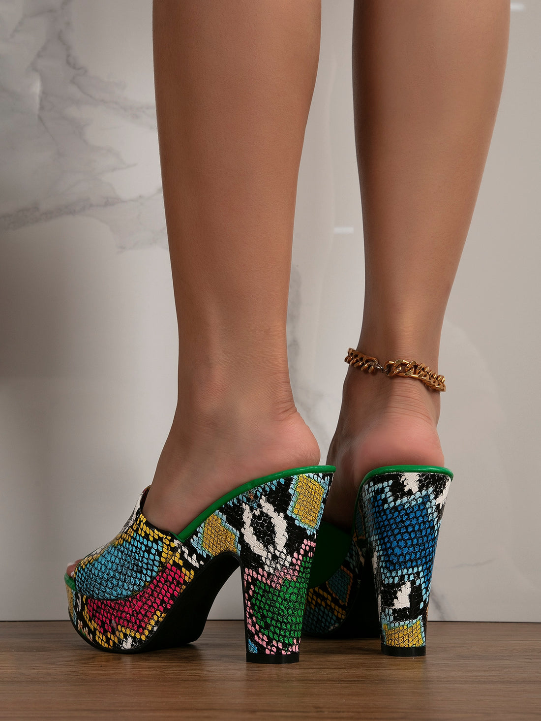 Elevate your style with our Trendy Snakeskin Embossed Chunky Heeled Mule Sandals. With a chic snakeskin texture and bold chunky heel, these sandals add a stylish touch to any outfit. The platform design provides extra height and comfort, making them perfect for any fashion-forward statement.